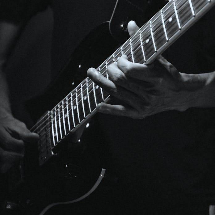 Close-up of musician playing electric guitar